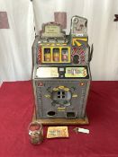 A VINTAGE TOTALISATOR SLOT MACHINE.