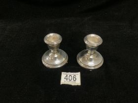 PAIR OF HALLMARKED SILVER CIRCULAR SQUAT CANDLESTICKS; BIRMINGHAM 1977; A T CANNON LTD; 7 CMS (