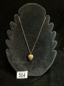 A 9CT HALLMARKED GOLD HEART LOCKET ON 9CT GOLD CHAIN; 5.5 GMS.