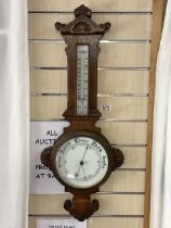 VICTORIAN CARVED OAK ANEROID BAROMETER.