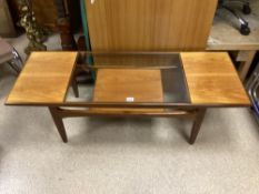 A MID-CENTURY MODERN TEAK COFFEE TABLE WITH GLASS INSERT; 137 X 50CM
