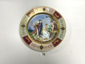 VIENNA PORCELAIN WALL PLATE DECORATED WITH MAIDENS AND PUTTI, AND GILDED; 37 CMS DIAMETER.