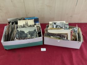 A QUANTITY OF BLACK AND WHITE POSTCARDS