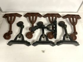 TWO SETS OF CAST IRON BED CASTORS, BY YONO.