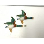 TWO PORCELAIN FLYING DUCKS.