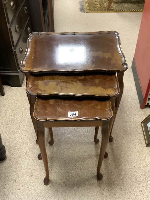 A WALNUT NEST OF THREE SHAPED TABLES.