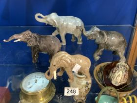 A BESWICK ELEPHANT, SYLVAC ELEPHANT AND TWO OTHERS.