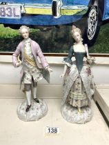 A PAIR OF CONTINENTAL PORCELAIN FIGURES OF LADY AND GENT IN 18TH-CENTURY DRESS, 27 CM.