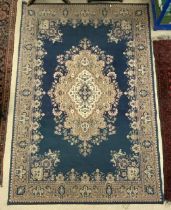 A BLUE AND PINK GROUND PERSIAN PATTERN MACHINE MADE CARPET, 188X274 CMS.
