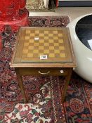 A SMALL CHESS TOP GAMES TABLE WITH CHESS PIECES AND DRAUGHTS, 38 CMS SQUARE.