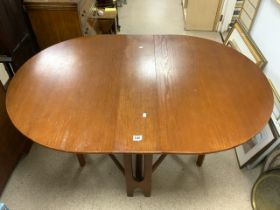 A MID-CENTURY DROP LEAF DINING TABLE