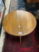 A SMALL BLONDE ERCOL DROP LEAF COFFEE TABLE.