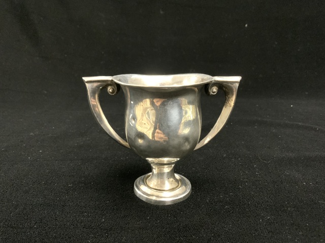 A SMALL TWO HANDLE TROPHY CUP MARKED STERLING; 54 GMS. - Image 5 of 5