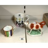 A 1953 CORONATION MUG FROM A DESIGN BY ERIC RAVILIOUS, A/F, STAFFORDSHIRE COW CREAMER AND A 19TH-