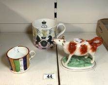 A 1953 CORONATION MUG FROM A DESIGN BY ERIC RAVILIOUS, A/F, STAFFORDSHIRE COW CREAMER AND A 19TH-