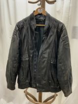 A BLACK LEATHER JACKET - BY LEDA LEATHER INDIA.