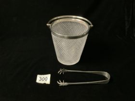 A VICTORIAN CUT GLASS ICE BUCKET, HALLMARKED SILVER HANDLE AND RIM WITH MATCHING TONGS,