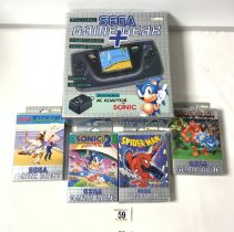 1990s SEGA GAMEGEAR PLUS HAND HELD GAME SYSTEM; IN ORIGINAL BOX AND FOUR GAMES.