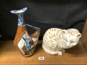 A STUDIO POTTERY FIGURE OF A CAT, DATED 1966, 25 CMS AND A CERAMIC AND LEATHER ABSTRACT WINE JUG.