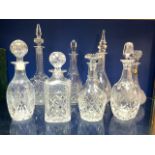SIX CUT GLASS DECANTERS - VARIOUS.
