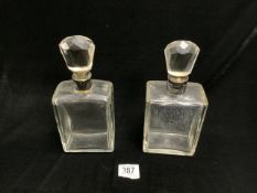 A PAIR OF SILVER COLLARED LOCKING GLASS DECANTERS; ONE A/F