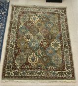 A GREEN AND BLUE GROUND PERSIAN PATTERN RUG, 164X244 CMS.
