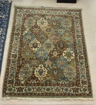 A GREEN AND BLUE GROUND PERSIAN PATTERN RUG, 164X244 CMS.