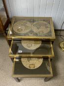 VINTAGE NEST OF TABLES WITH OLD MAPS OF THE WORLD AND BRASS SURROUND
