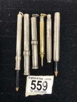 A YELLOW METAL SAMPSON MORDAN PROPELLING PENCIL, AND THREE SILVER AND TWO PLATED SAMPSON MORDAN