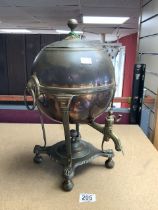 A GLOBULAR SHAPED COPPER SAMOVAR ON PLATFORM BASE WITH CLAW FEET.