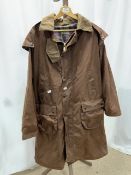 A BROWN WAXED OVERCOAT, BY P G FIELD, SIZE XL.