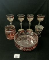 CUT GLASS RUBY FLASH FRUIT BOWL, FOUR WINE GLASSES, SMALL VASE AND JAR.