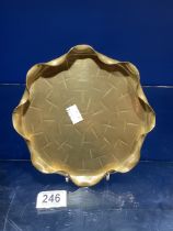 A BURMESE SHAPED BRASS PLATE, 20 CMS.