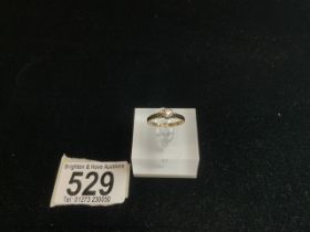 A 375 HALLMARKED GOLD SOLITAIRE DIAMOND RING.50