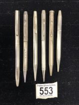 SILVER PROPELLING PENCIL BY MORRIS & WEST LTD, FOUR OTHER SILVER PROPELLING PENCILS, AND A