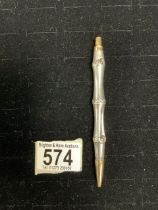 A GUCCI SILVER AND YELLOW METAL FAUX BAMBOO DESIGN PENCIL.