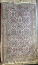 A PINK GROUND PERSIAN PATTERN RUG, 230X148 CMS.