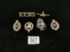 A FRENCH MILITARY LOCKET BROOCH, MILITARY BADGES AND A SWEETHEART BROOCH.
