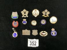 TWO STERLING SILVER AND ENAMEL YPRES MILITARY BADGES AND OTHERS, PLUS RAC BADGE.
