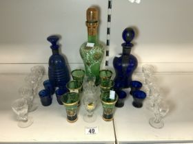 TWO BRISTOL BLUE GLASS SHERRY DECANTERS WITH 6 GLASSES, GREEN GLASS SHERRY DECANTER WITH GLASSES AND