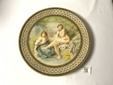 A CONTINENTAL MAJOLICA WALL PLATE, DECORATED WITH NUDE ATTENTIVE LADIES, 35 CMS.