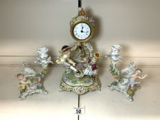 A DRESDEN PORCELAIN SEE-SAW FIGURE MANTLE CLOCK (QUARTZ MOVEMENT); GERMANY; 30 CM AND A PAIR OF