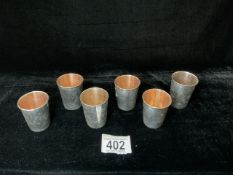 SIX ENGRAVED WHITE METAL TOASTING CUPS STAMPED 875. 180 GMS.