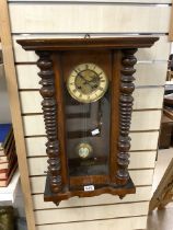 A 19TH-CENTURY WALNUT-CASED VIENNA WALL CLOCK WITH PENDULUM AND KEY 69CM