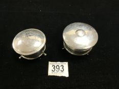 TWO HALLMARKED CIRCULAR SILVER RING BOXES RAISED ON PAD FEET, BIRMINGHAM 1924 AND 1915, ONE BY A & J