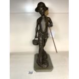 A BRONZE EFFECT COMPOSITE FIGURE OF A BOY WITH FISHING NET AND BASKET, 40 CMS.