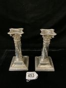 PAIR OF LATE VICTORIAN HALLMARKED SILVER EMBOSSED CANDLESTICKS,THE COLUMNS WITH TRAILING HUSK