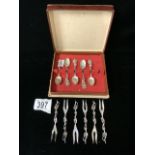 SIX WHITE METAL DUTCH PICKLE FORKS AND FIVE 800 SILVER COFFEE SPOONS.