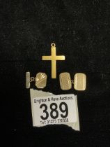 TWO 9CT GOLD CUFFLINKS, 3.5 GMS AND A YELLOW METAL CROSS, 1.5 GMS.