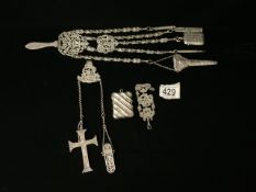A WHITE METAL CHATELAINE WITH ATTACHMENTS - INCLUDES, TWO VESTAS, PENCIL HOLDER, SILVER CROSS,